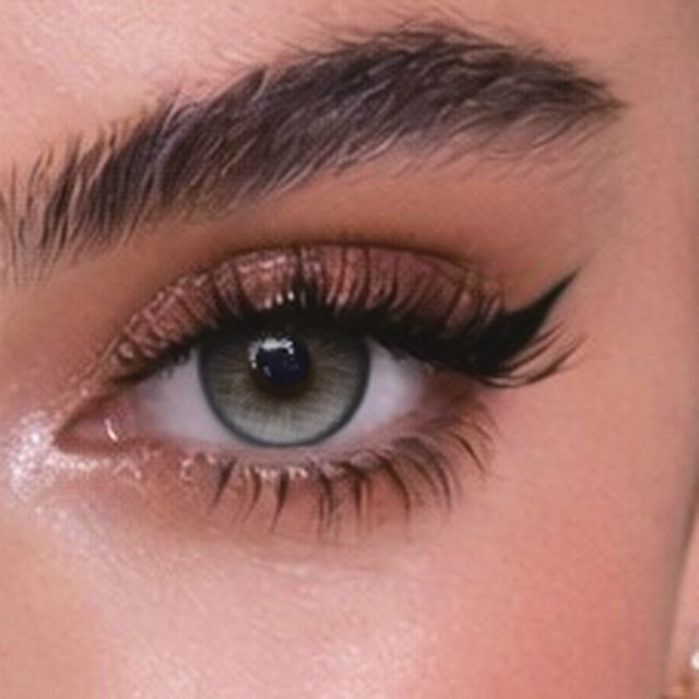 Close-up of an eye wearing Bella Gray lenses