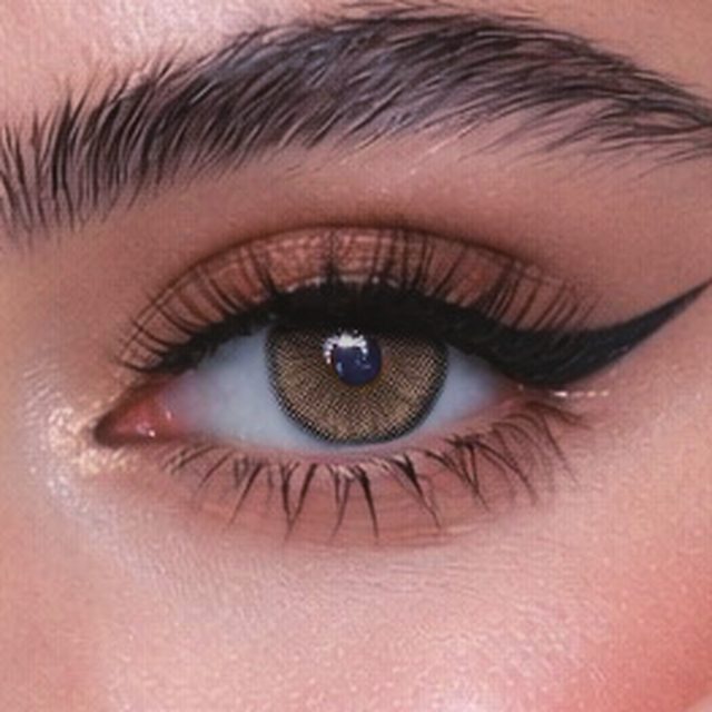 Close-up of an eye wearing Bella Hazel lenses