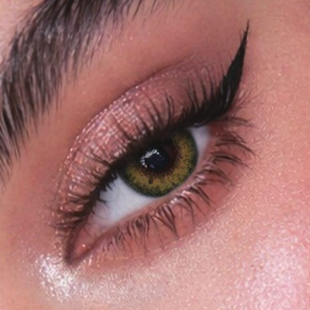 Close-up of an eye wearing Hazel Green lenses