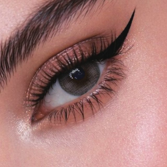 Close-up of an eye wearing Lady Gray lenses